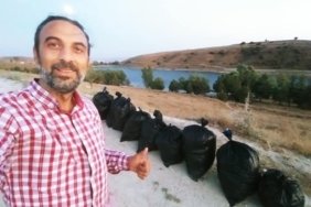 Balık tutmaya geldikleri gölette çöp topladılar